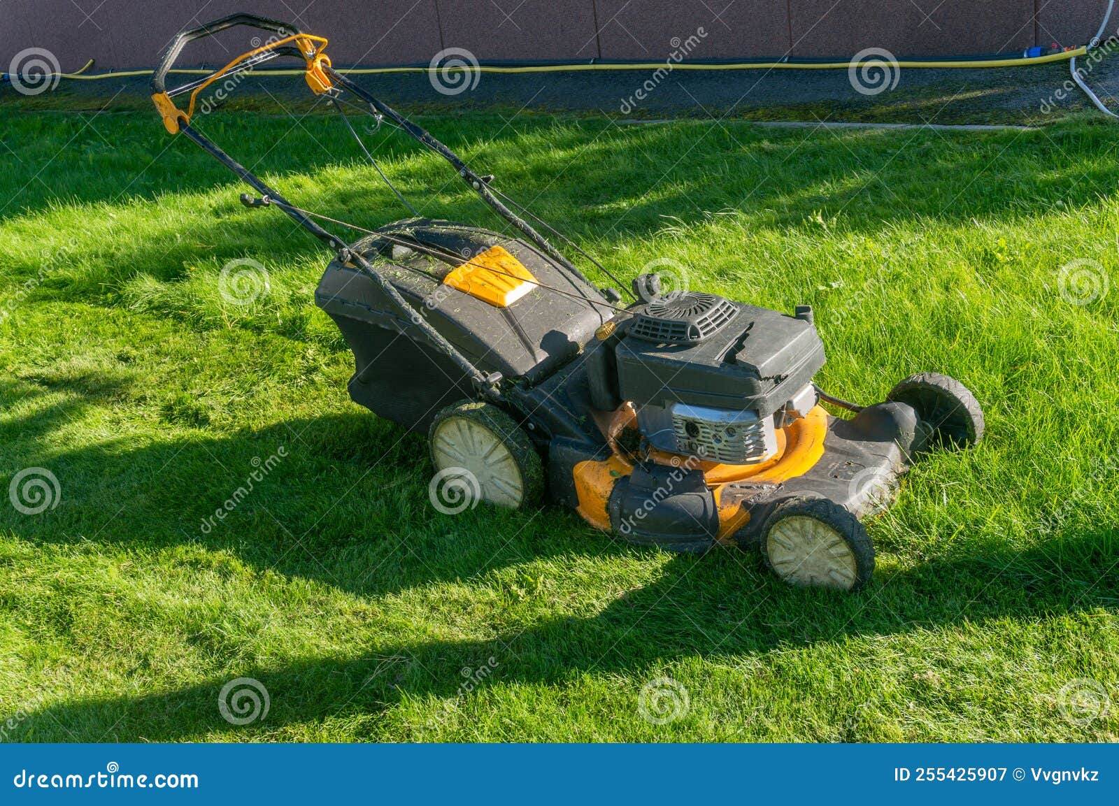 An Old Gasoline Lawn Mower on the Lawn Stock Image Image of garden