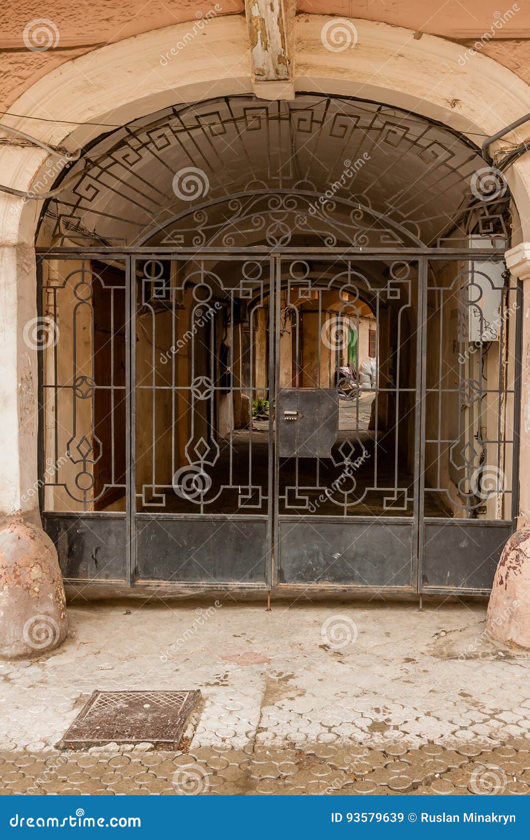 An Old Gate With A Corridor Leading To The Courtyard Of The House Stock