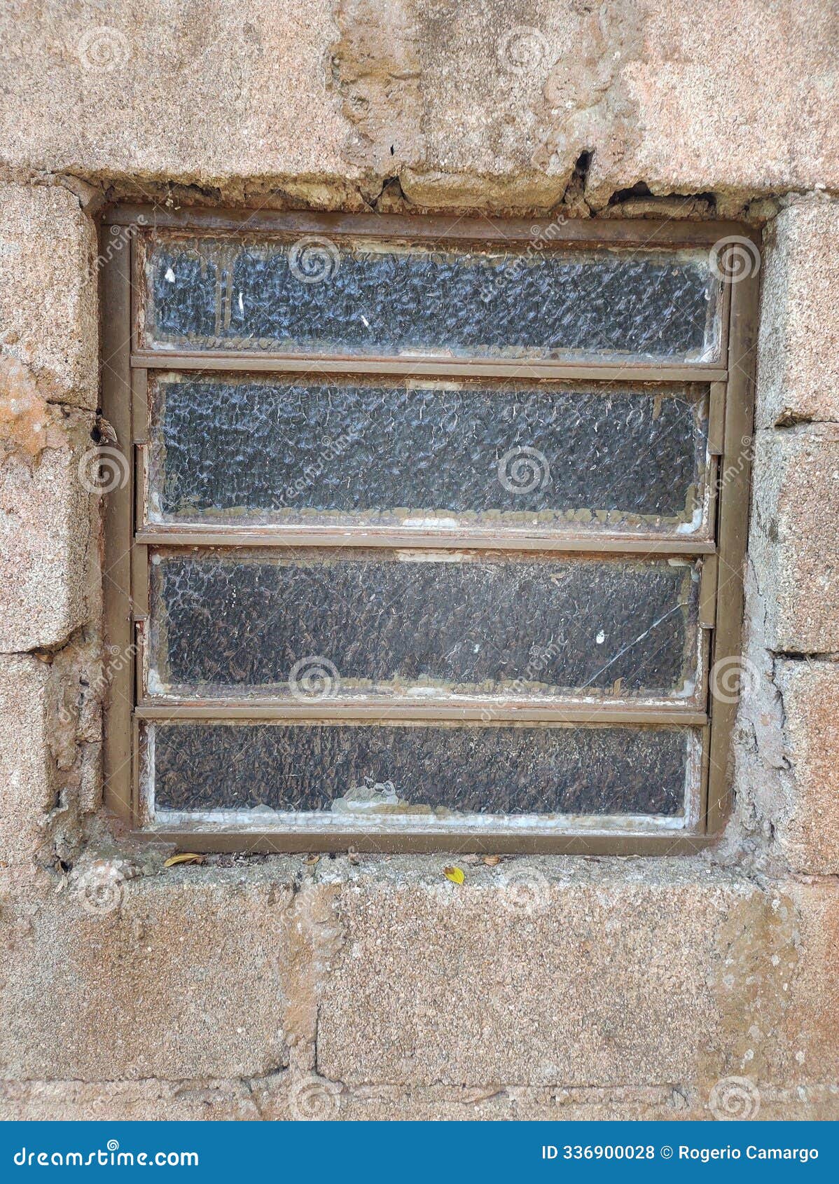 old glass window on a rustic wall