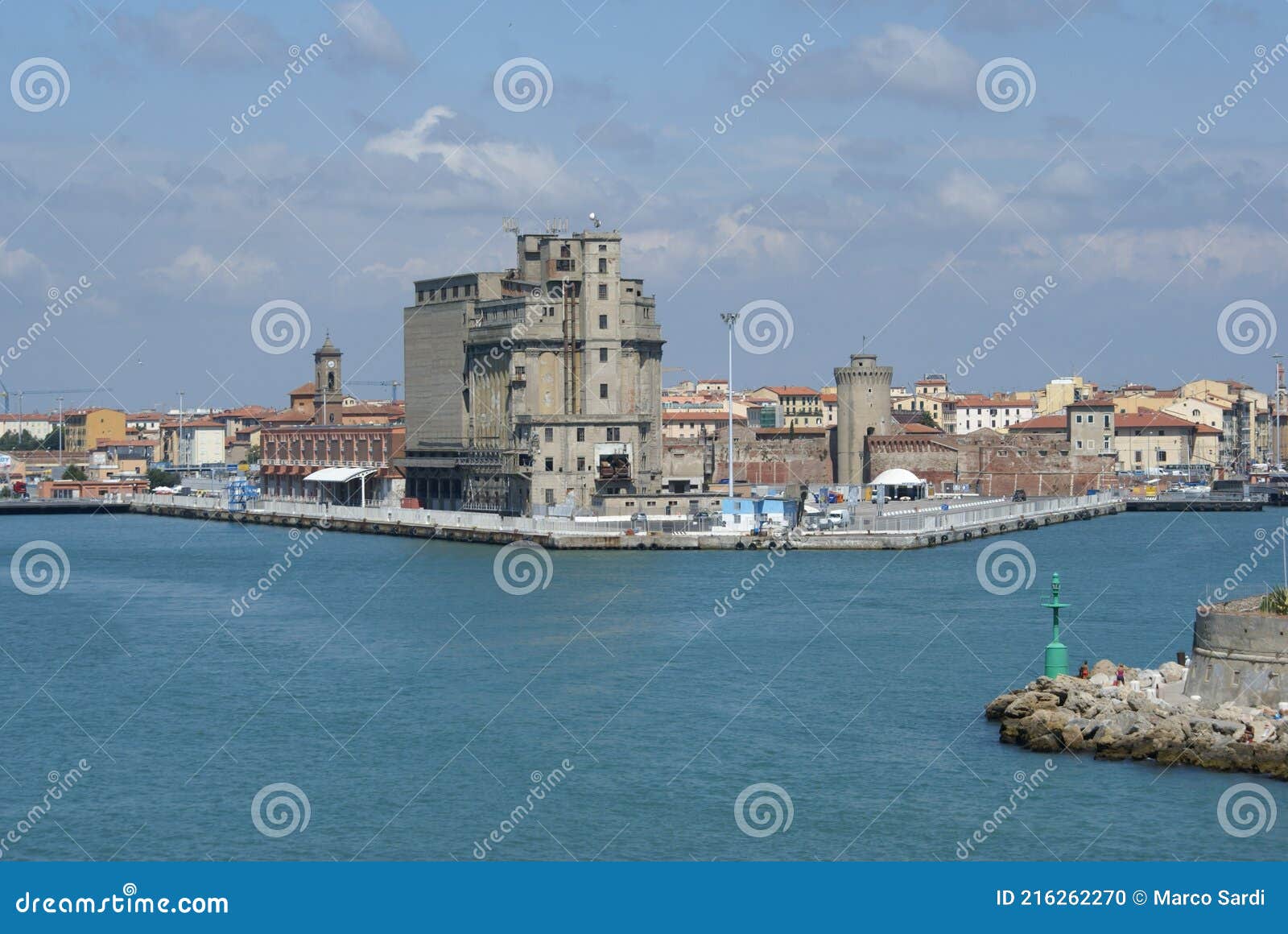the old grain silos and the old fortress in the port of livorno, italy