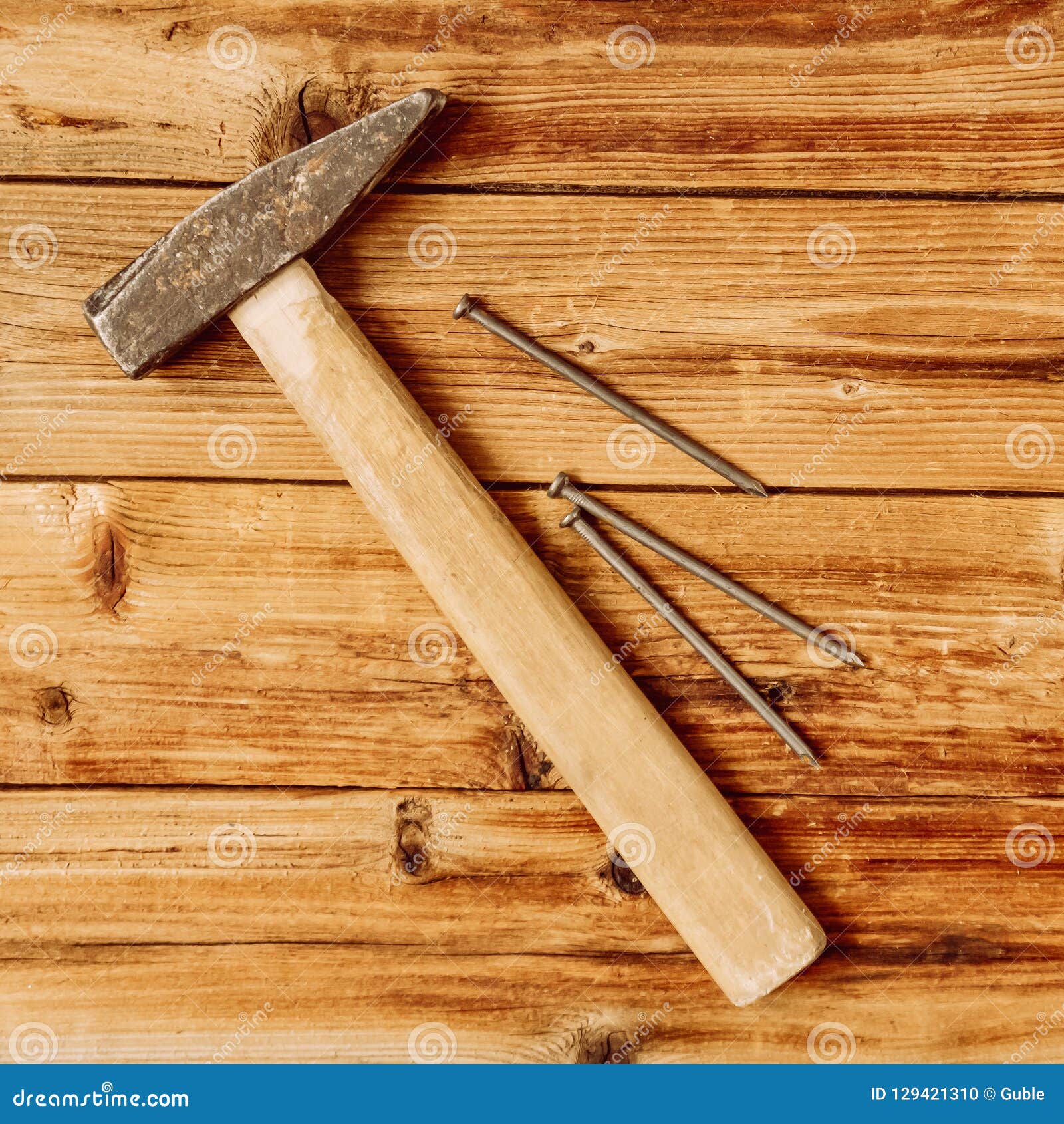 Old Hammer and Big Nails on Wooden Background. Stock Photo Image of