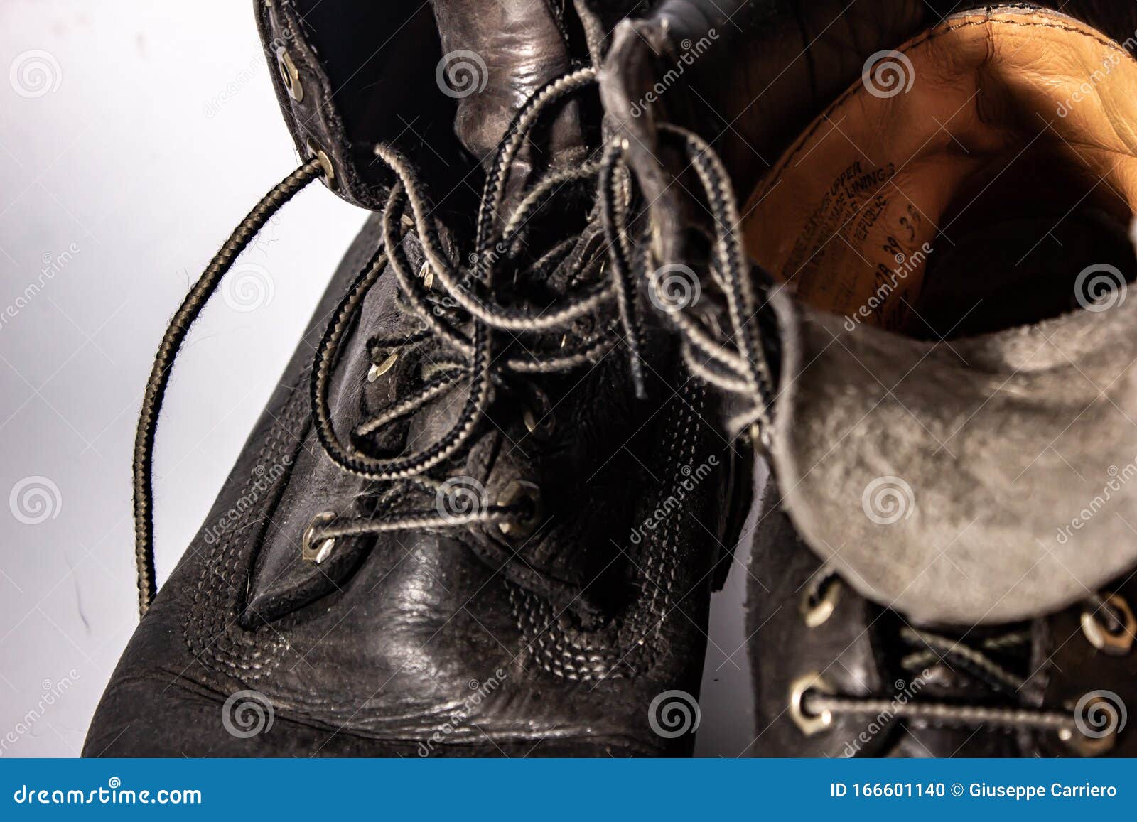 Old High Shoe Now Deformed, Brown-colored Boot Now Worn. Stock Photo ...