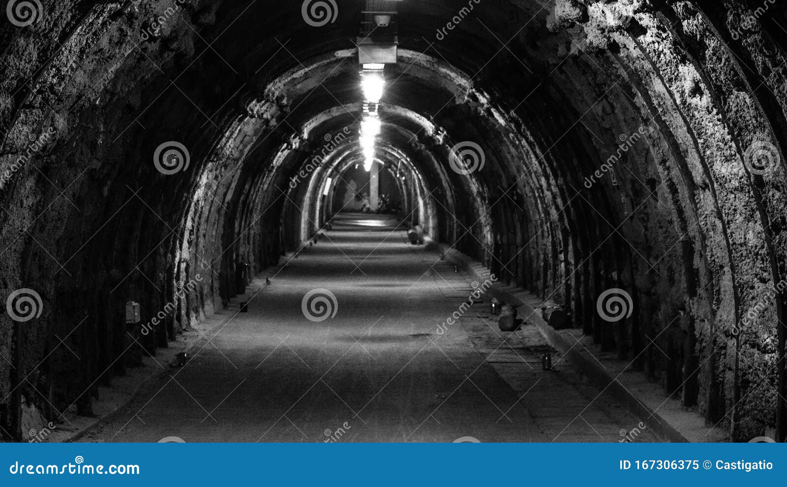 An Old, Illuminated, Hollow Underground Tunnel in a Closed Coal Mine