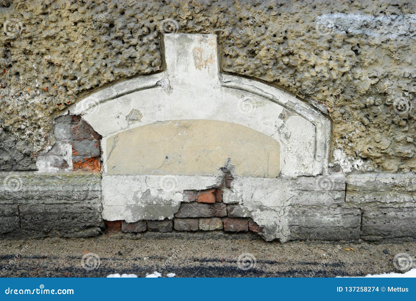 old immured window on grownd level