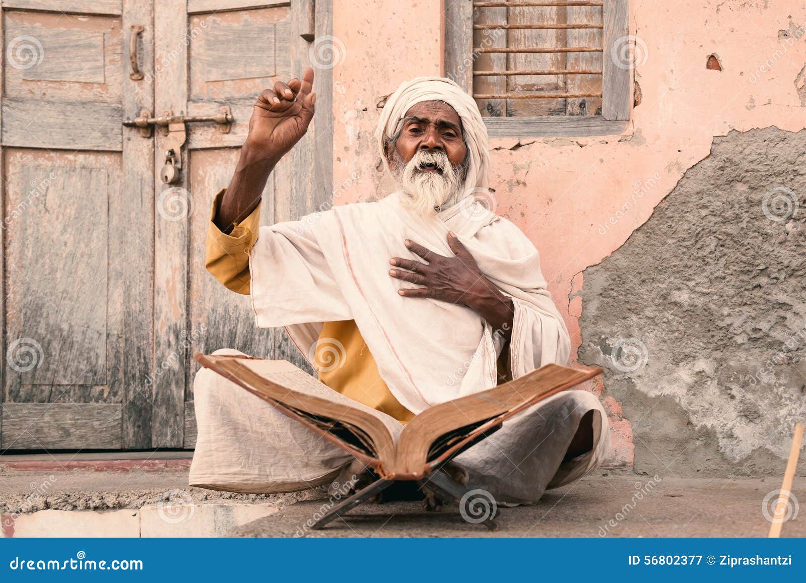 old indian sadhu speak up sacred scriptures.