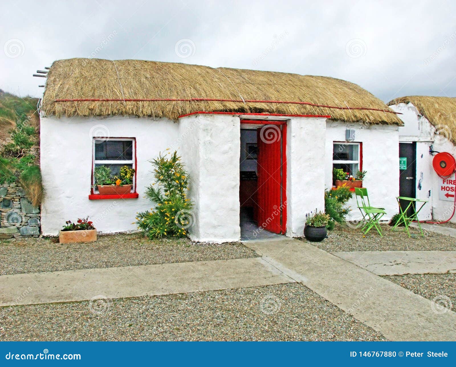 old irish thatch cottage in a village in ireland