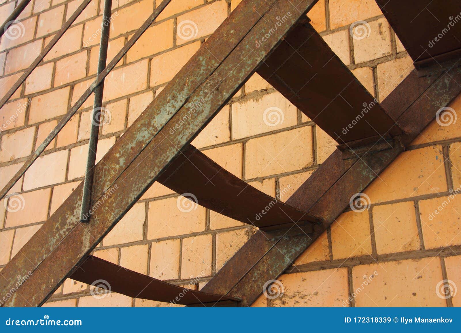 Old Iron Fire Escape Steps Against a Brick Wall Stock Image Image of