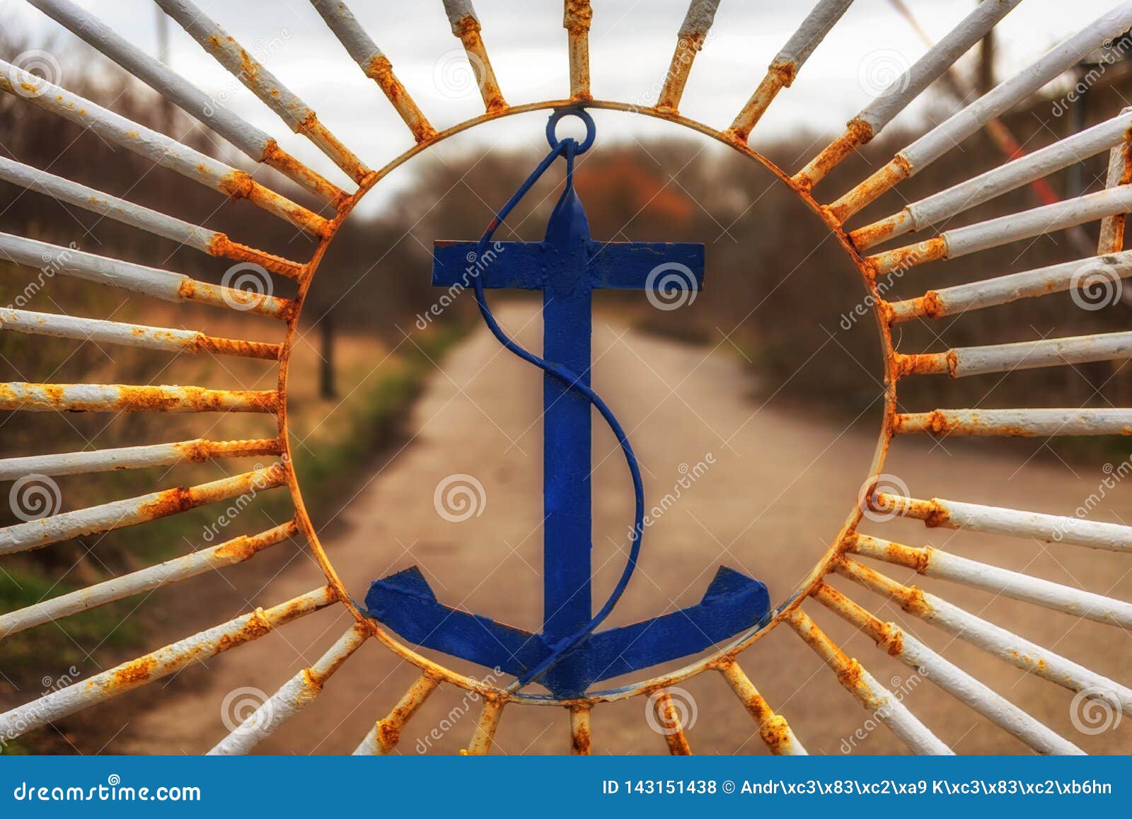 An Old Iron Gate Decorated with an Emblem of an Anchor Stock Photo