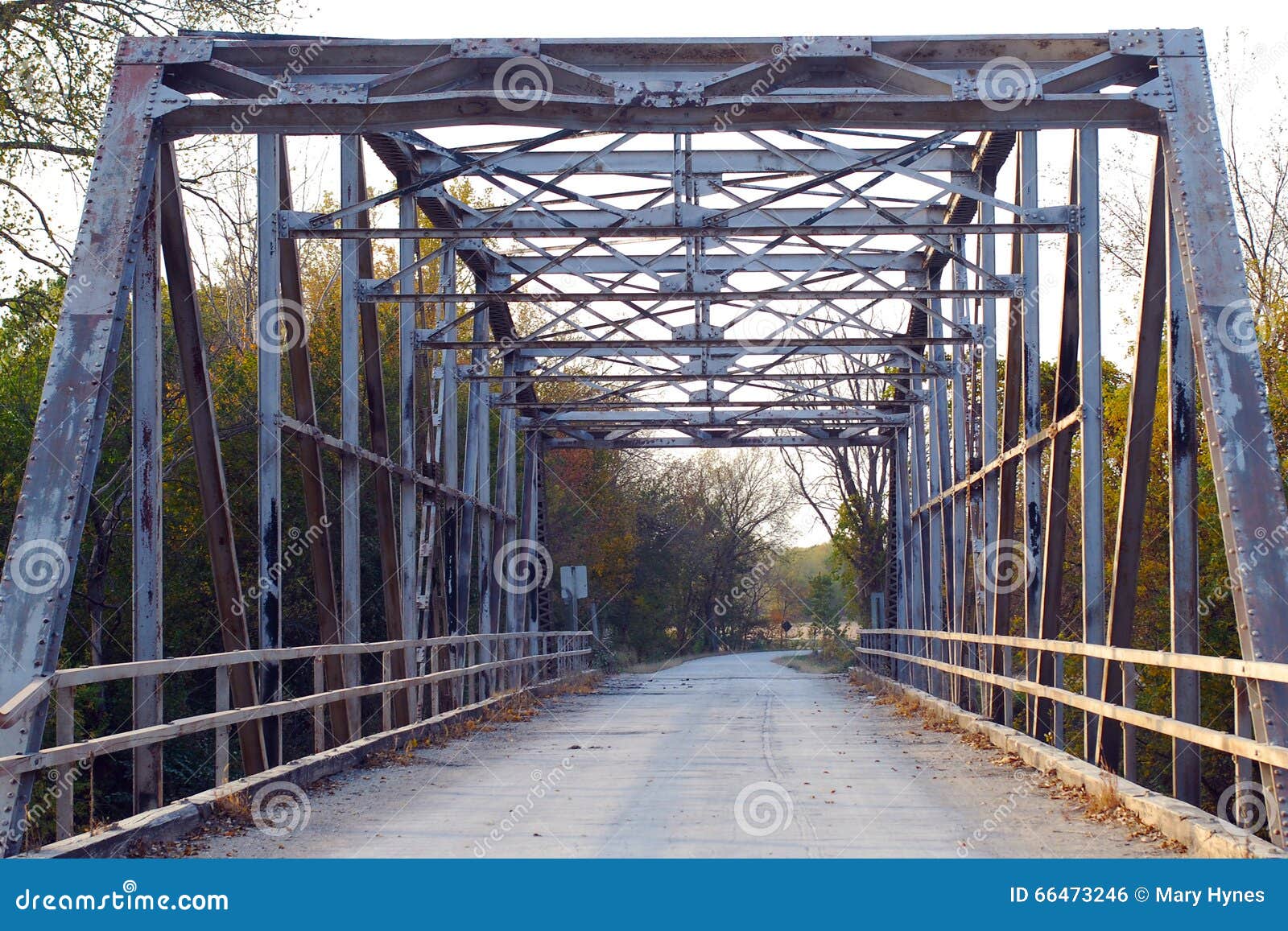 old iron metal truss bridge on country road