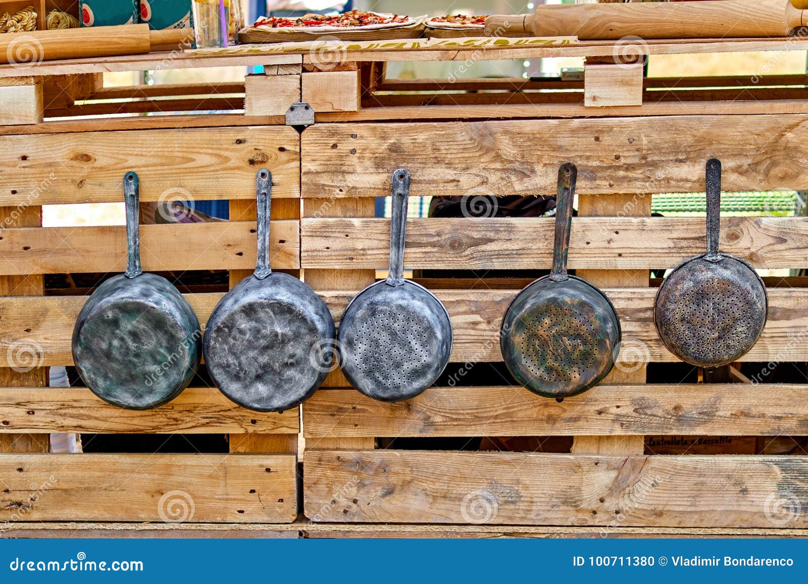 Old Iron Pots and Antique Frying Pans Hang on Hooks. Old Kitchen Utensils.  Stock Photo - Image of cooking, frying: 100711380