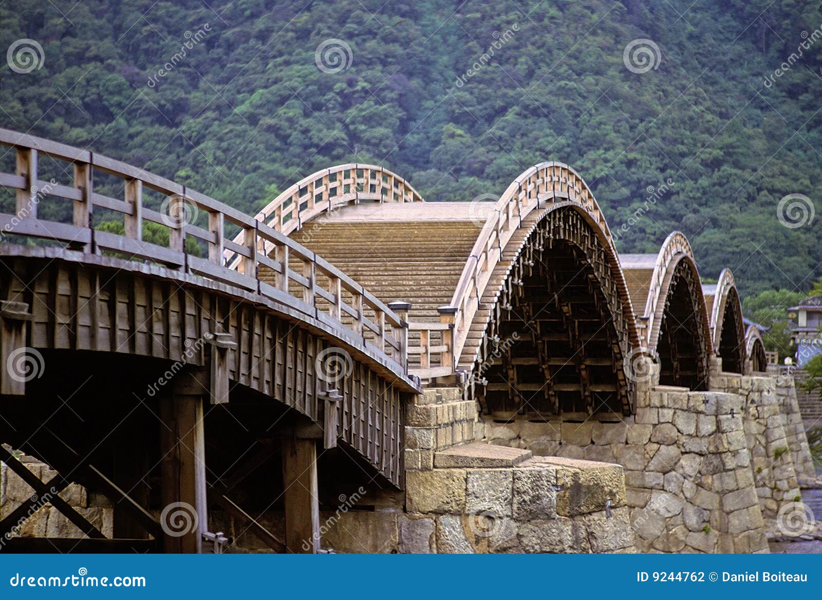 Famous old Kintai bridge showing unique wooden arches on stone pillars 