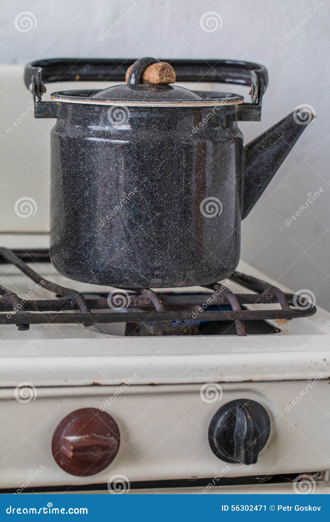 Old kettle on a gas stove stock image. Image of equipment 56302471