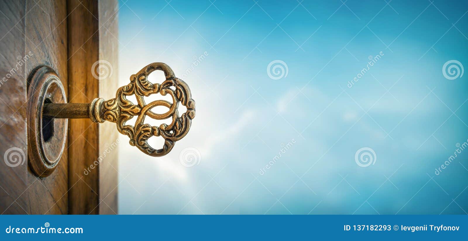 old key in keyhole on sky background with sun ray . concept,  and idea for history, business, security background