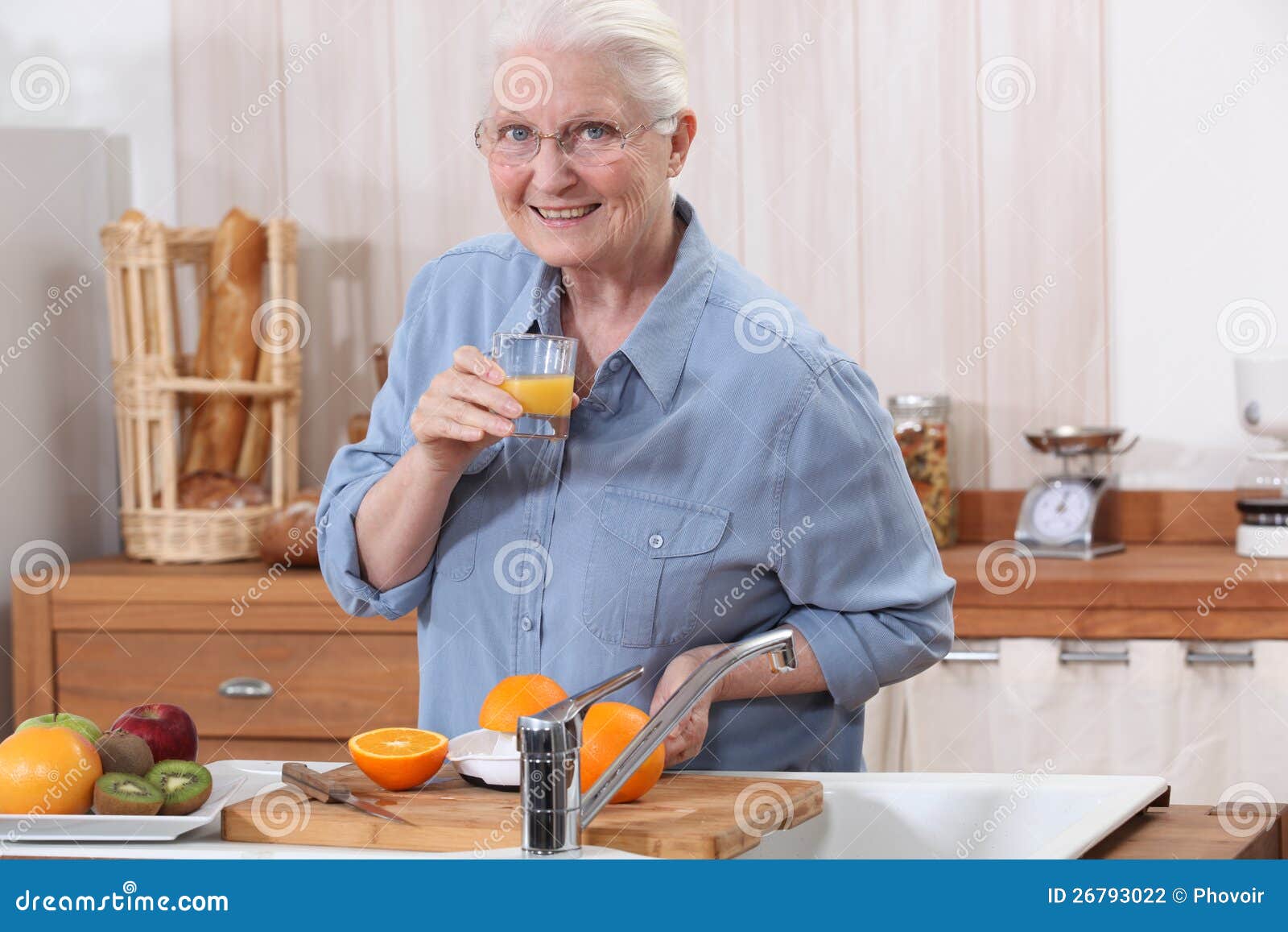 Old Lady Making Orange Juice. Stock Photo Image of holding, mature