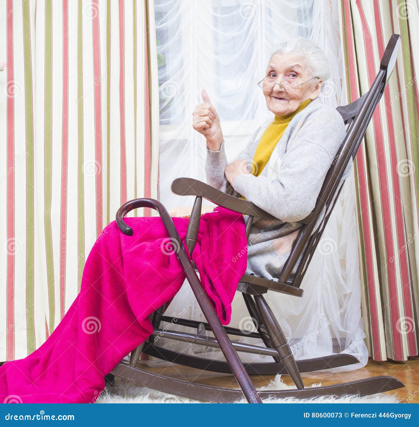 old-lady-thumbs-up-happy-elderly-chair-giving-80600073.jpg
