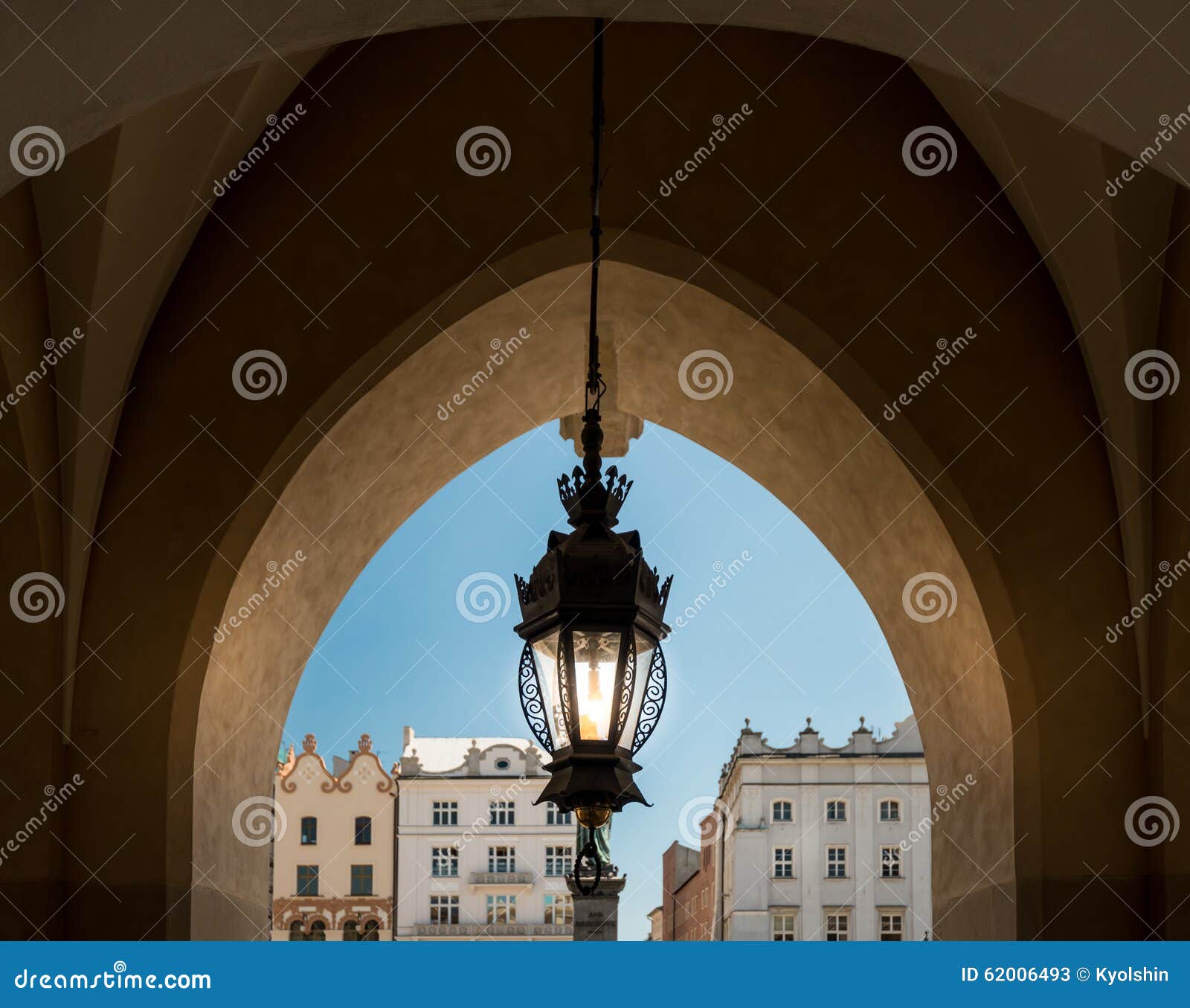 old lamp and krakow architecture. poland, europe.