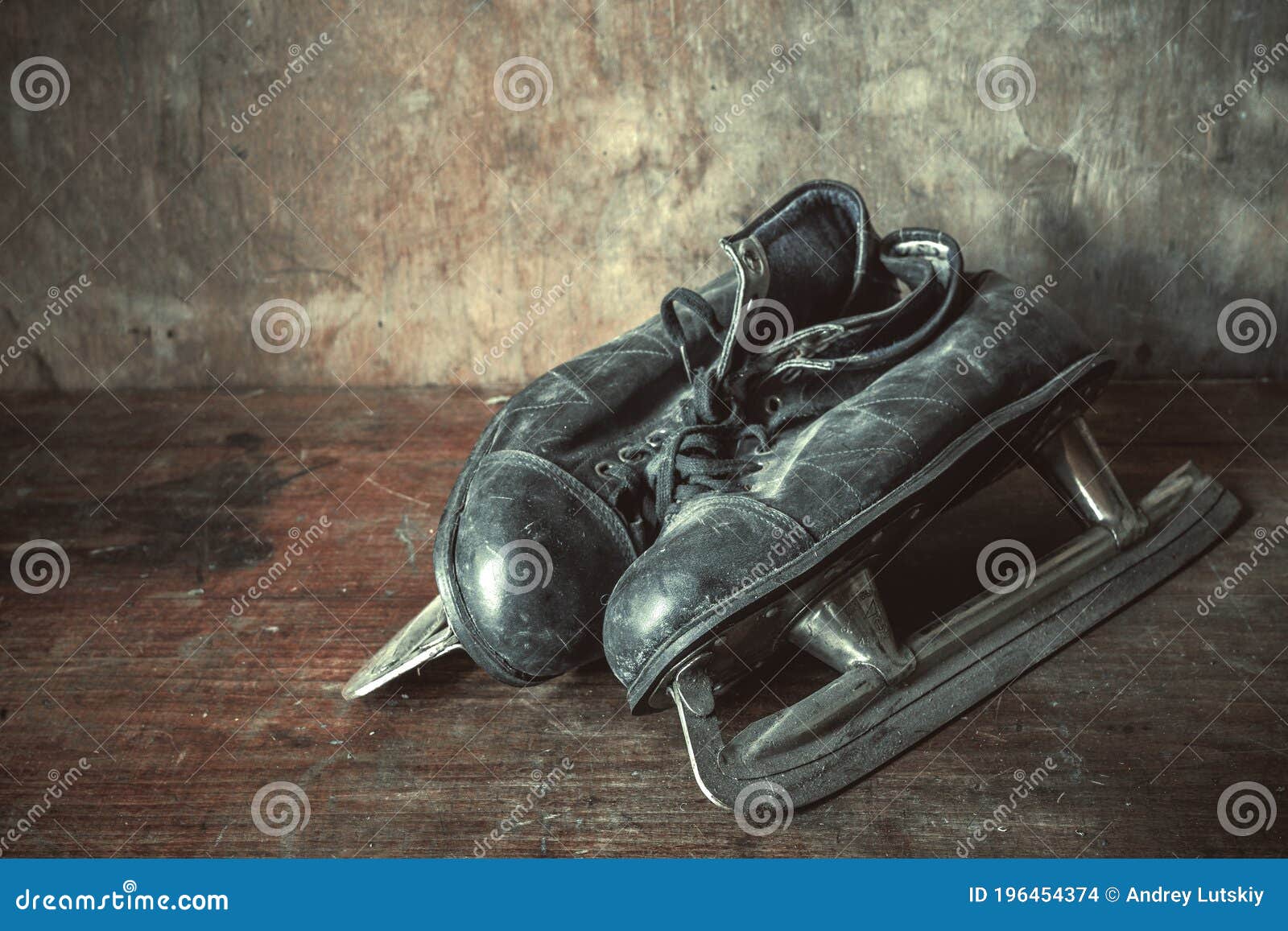 Old Leather Figure Skates in Black on a Retro Background Stock Photo