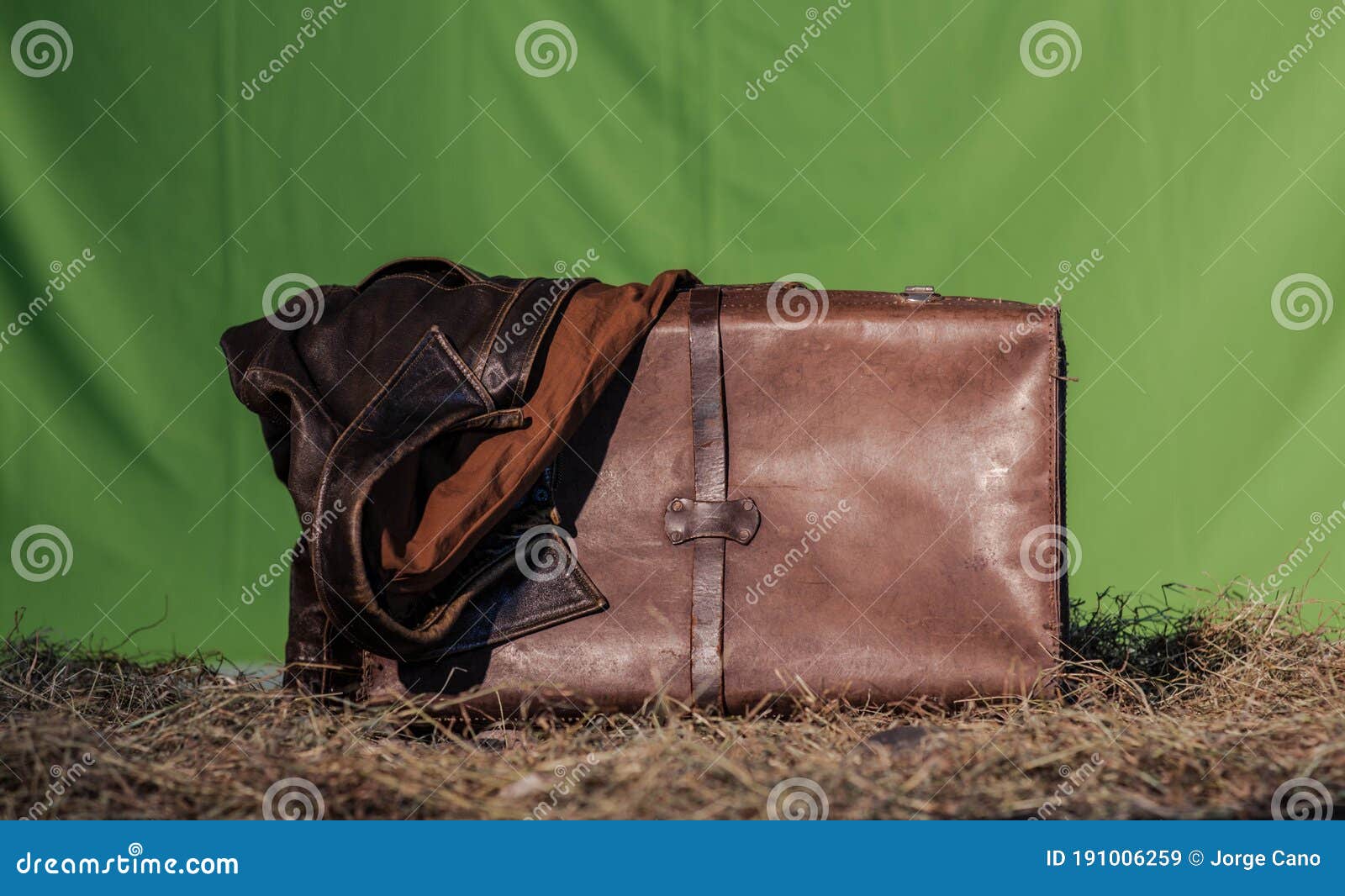 An Old Leather Suitcase and a Jacket in Green for Chroma Key Stock