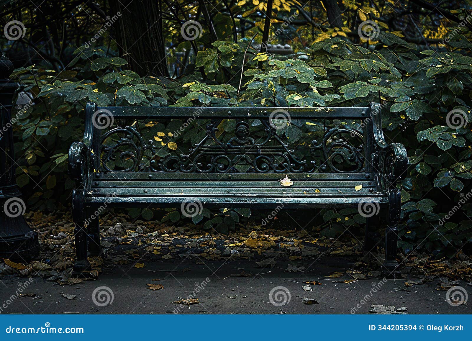 old lonely bench in dark deserted park against backdrop of autumn trees
