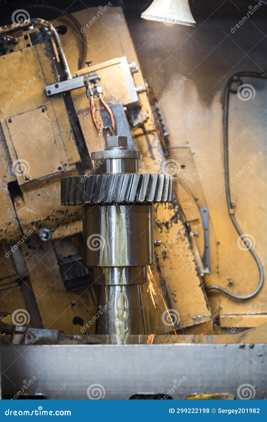 old machine processes a large metal part. cutting and cooling of the product