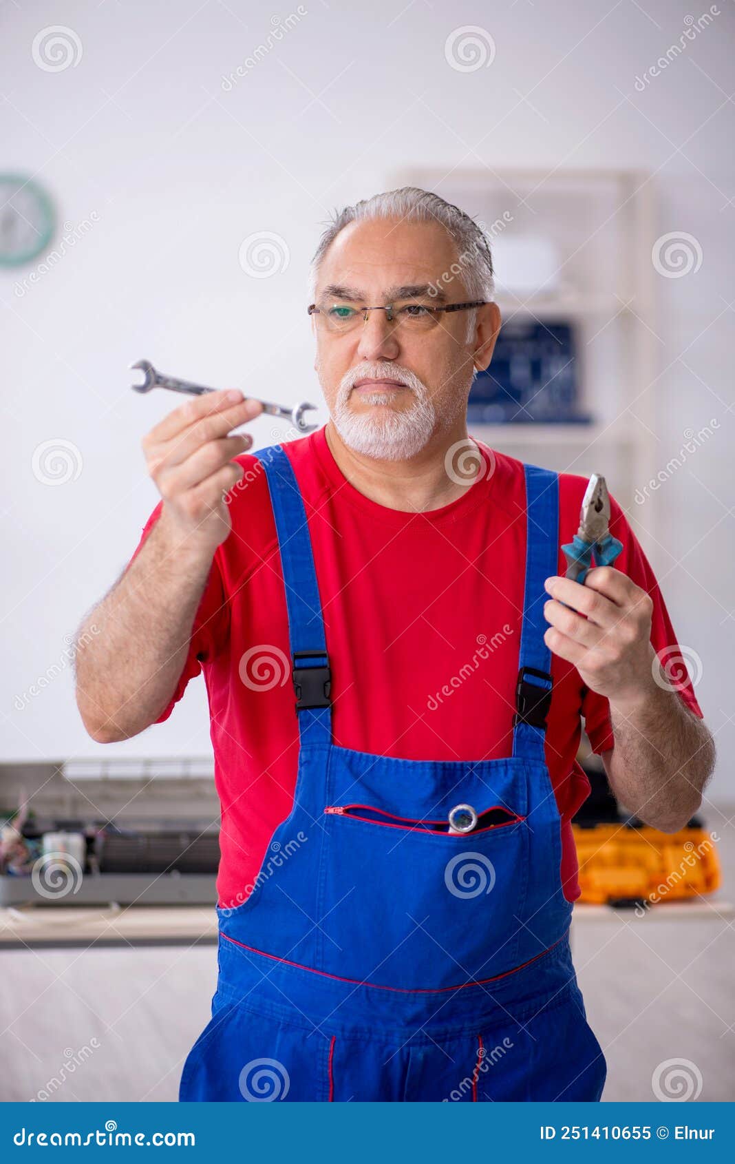 Old Male Repairman at Stock Image Image of problem, center