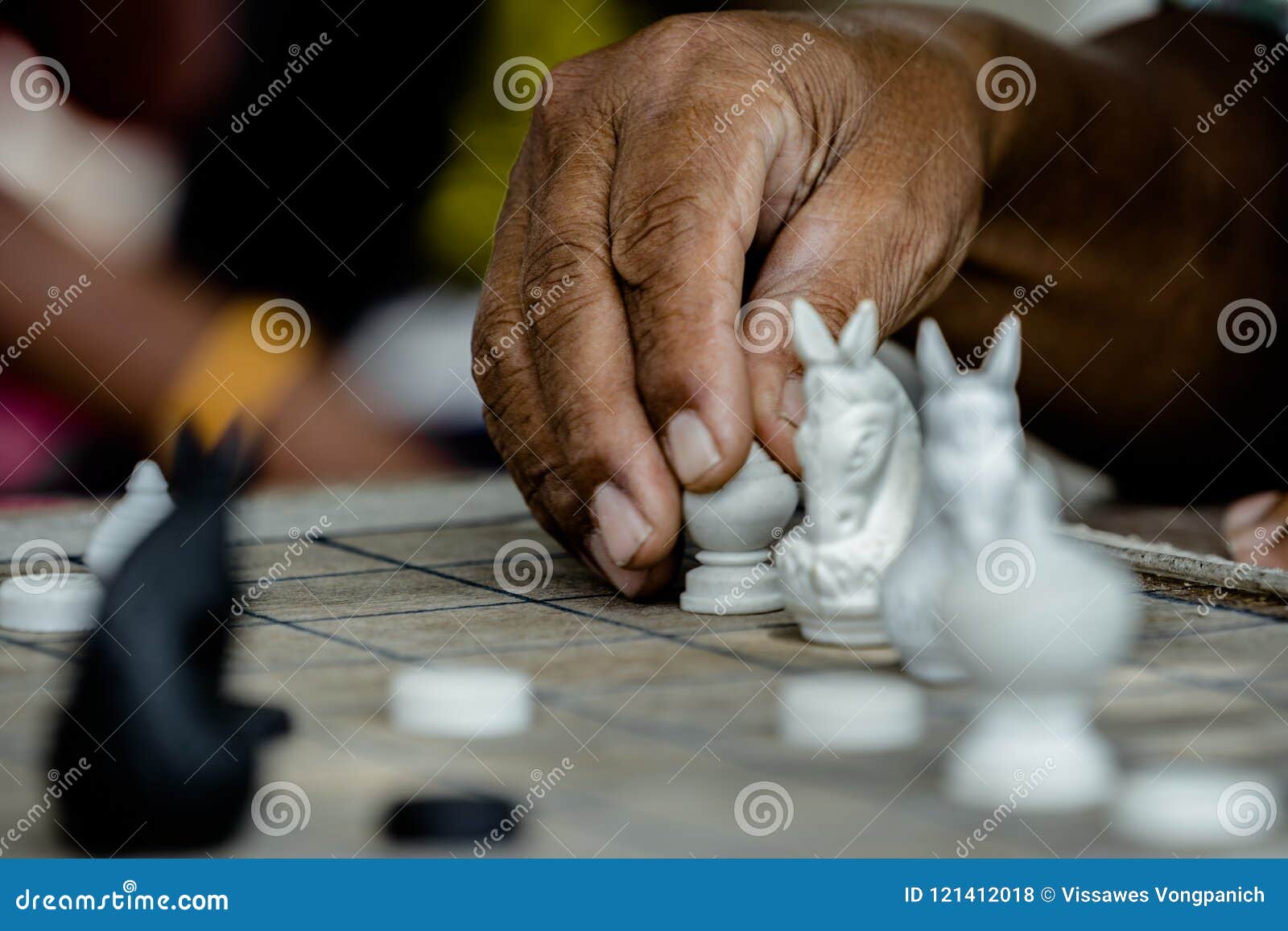 Local Thai people play old traditional Thai chess in public area - slow  life style local people with chess board game concept Stock Photo