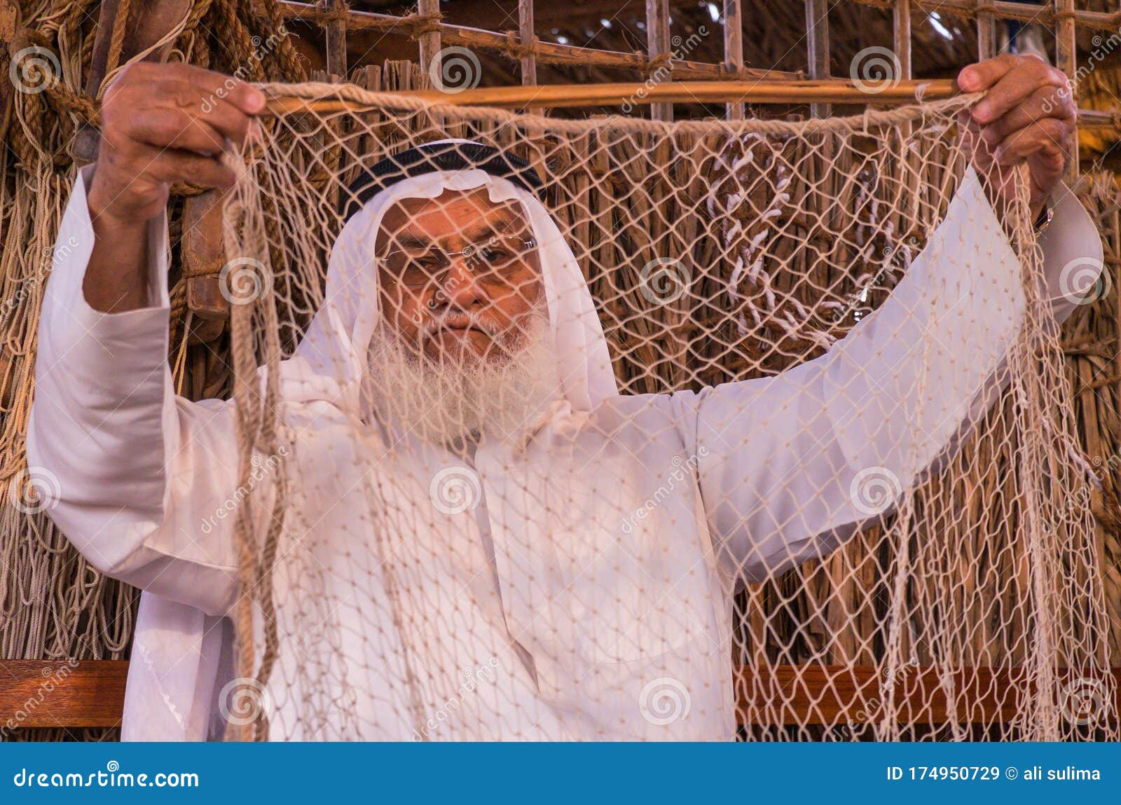 Old Man is Knitting Traditional Fishing Net in SHEIKH ZAYED HERITAGE  FESTIVAL Editorial Stock Image - Image of antique, elderly: 174950729