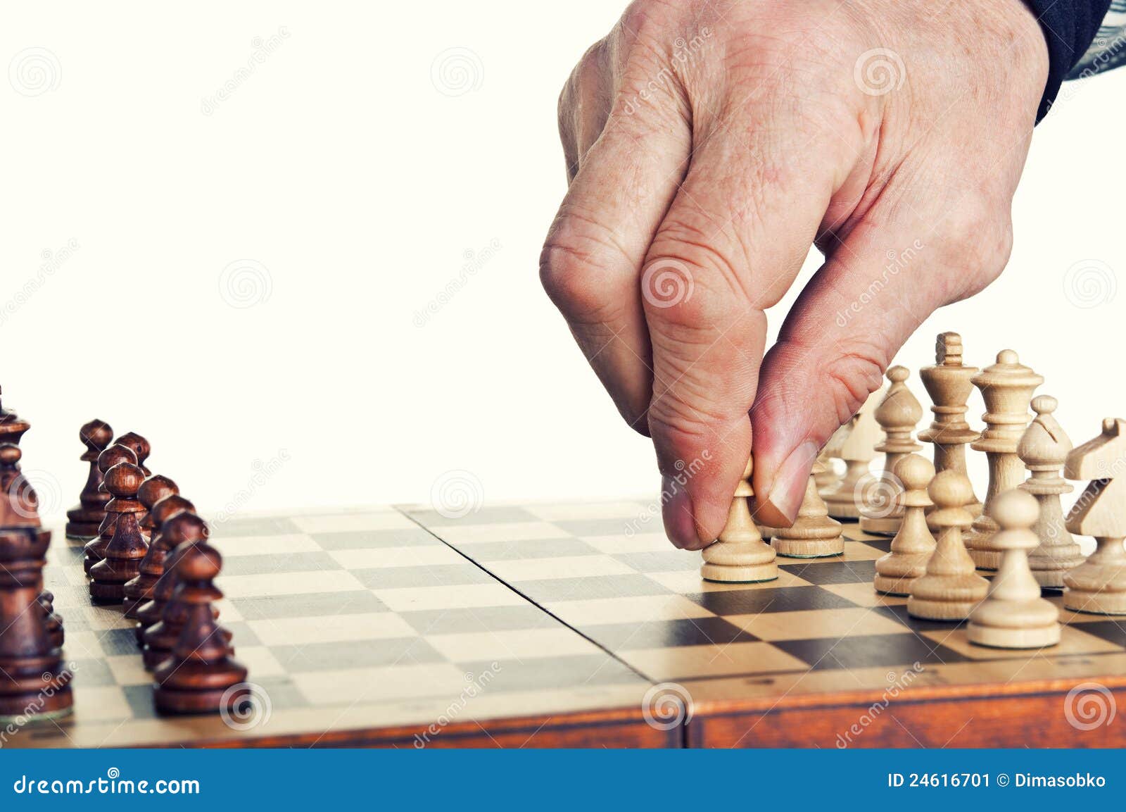 Serious man playing chess in studio · Free Stock Photo