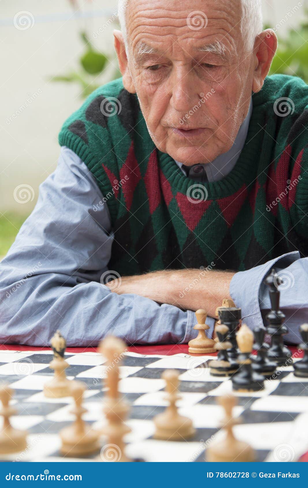 Old Man Playing Chess - Stock Photos