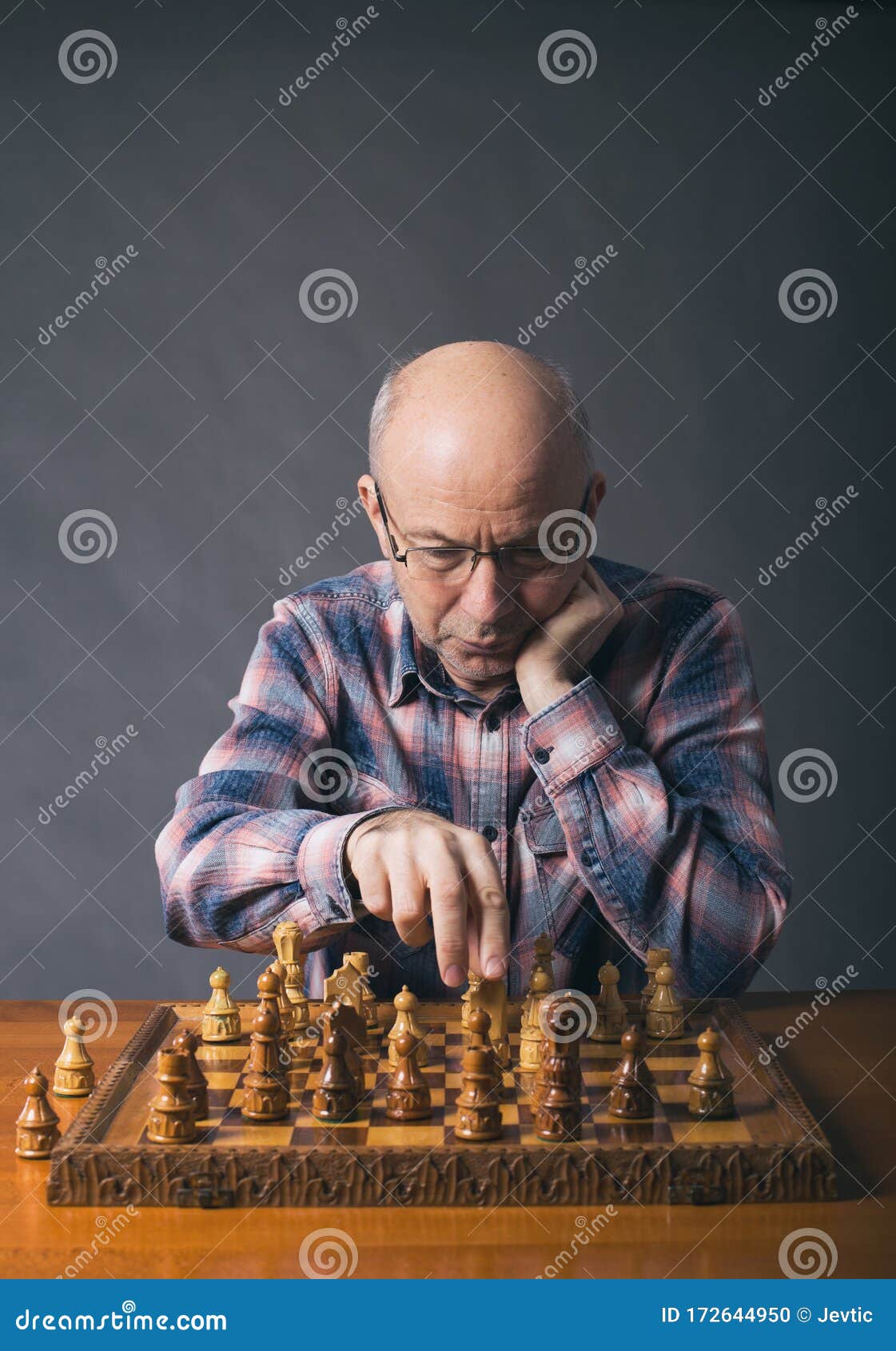 Old man playing chess stock photo. Image of board, player 172644950