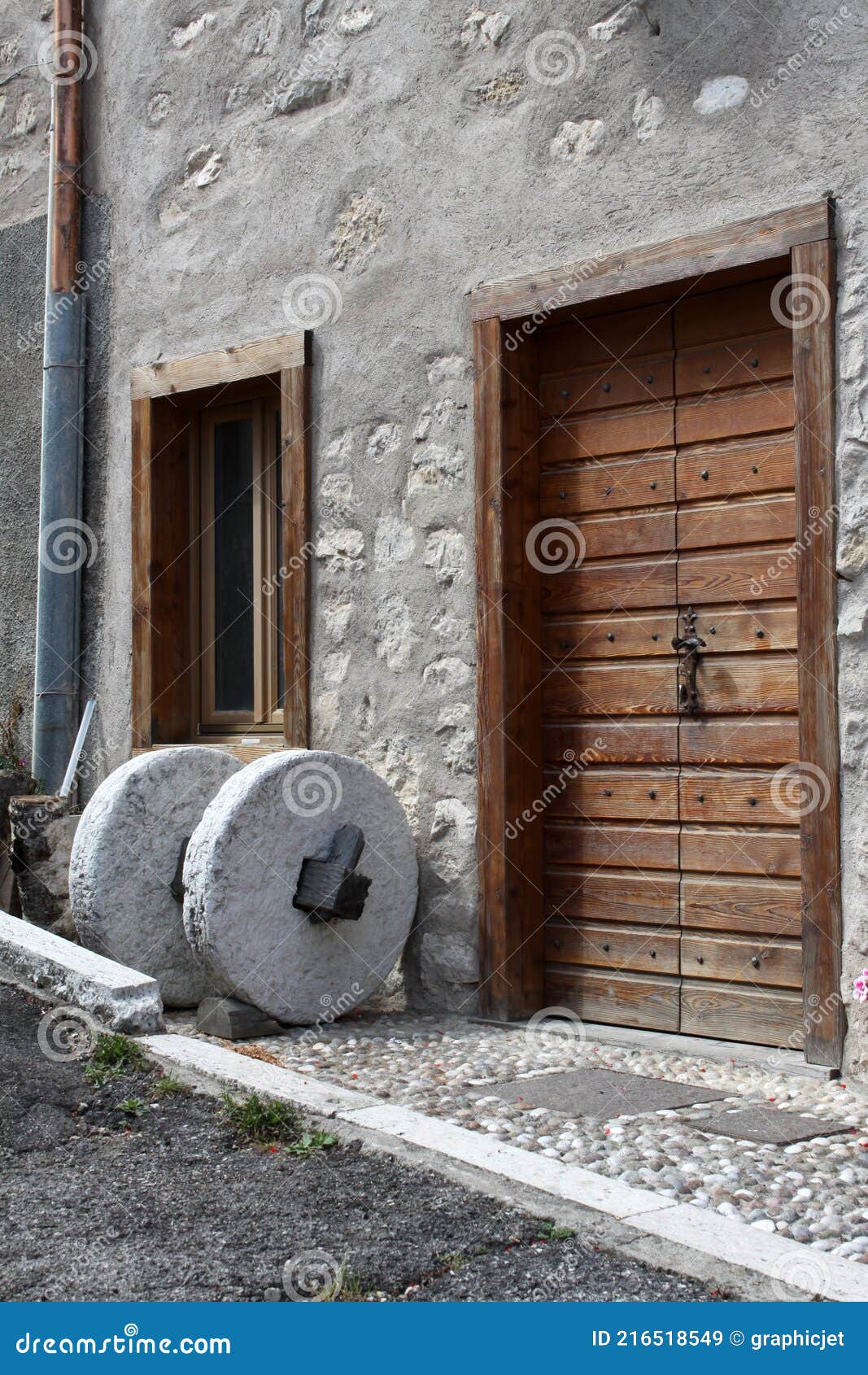 old millstone in guardia, rural town in trentino alto adige, italy