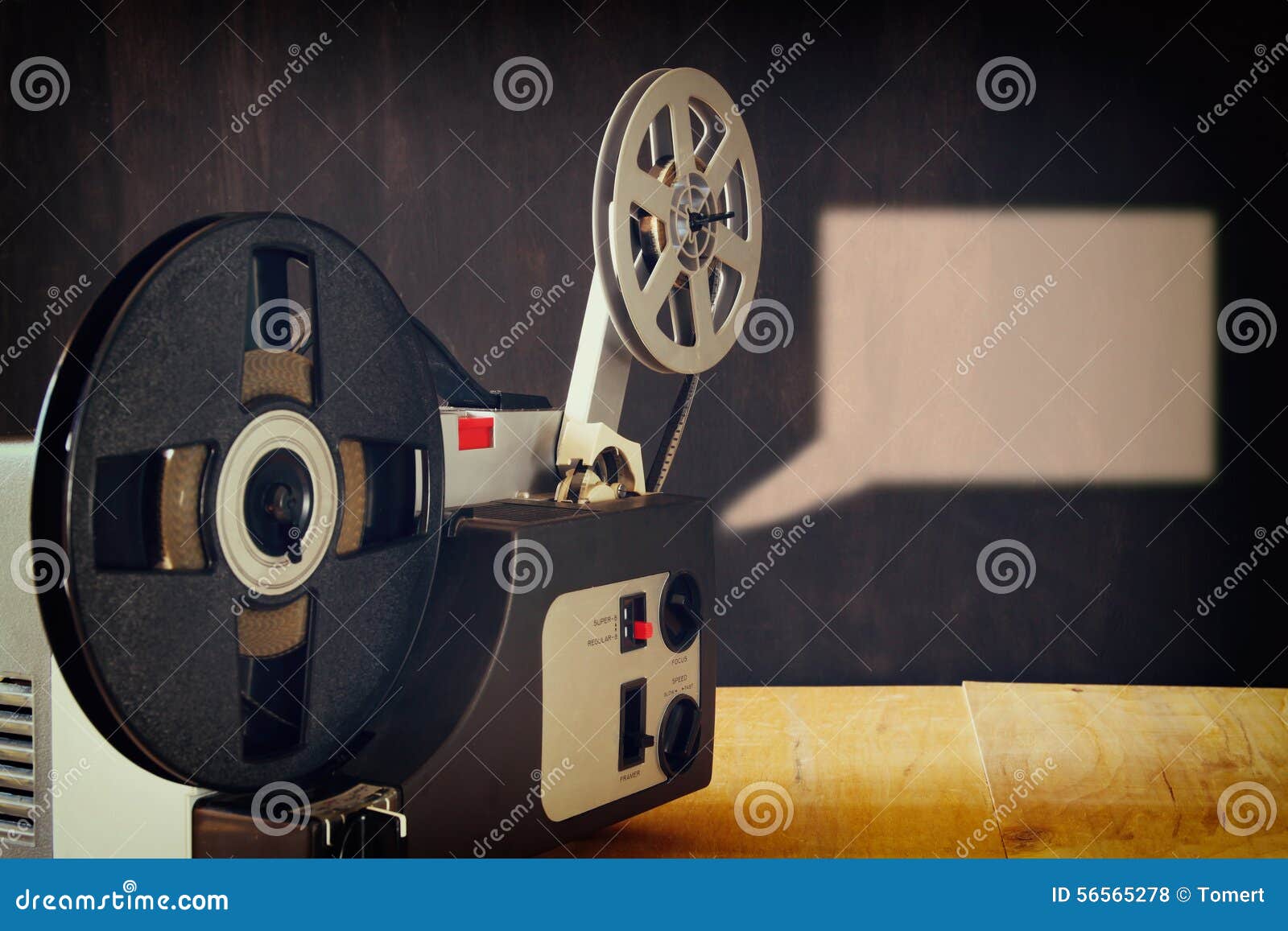 Old 8mm Film Projector Over Wooden Table and Textured Background Stock  Photo - Image of playlist, happy: 56565278