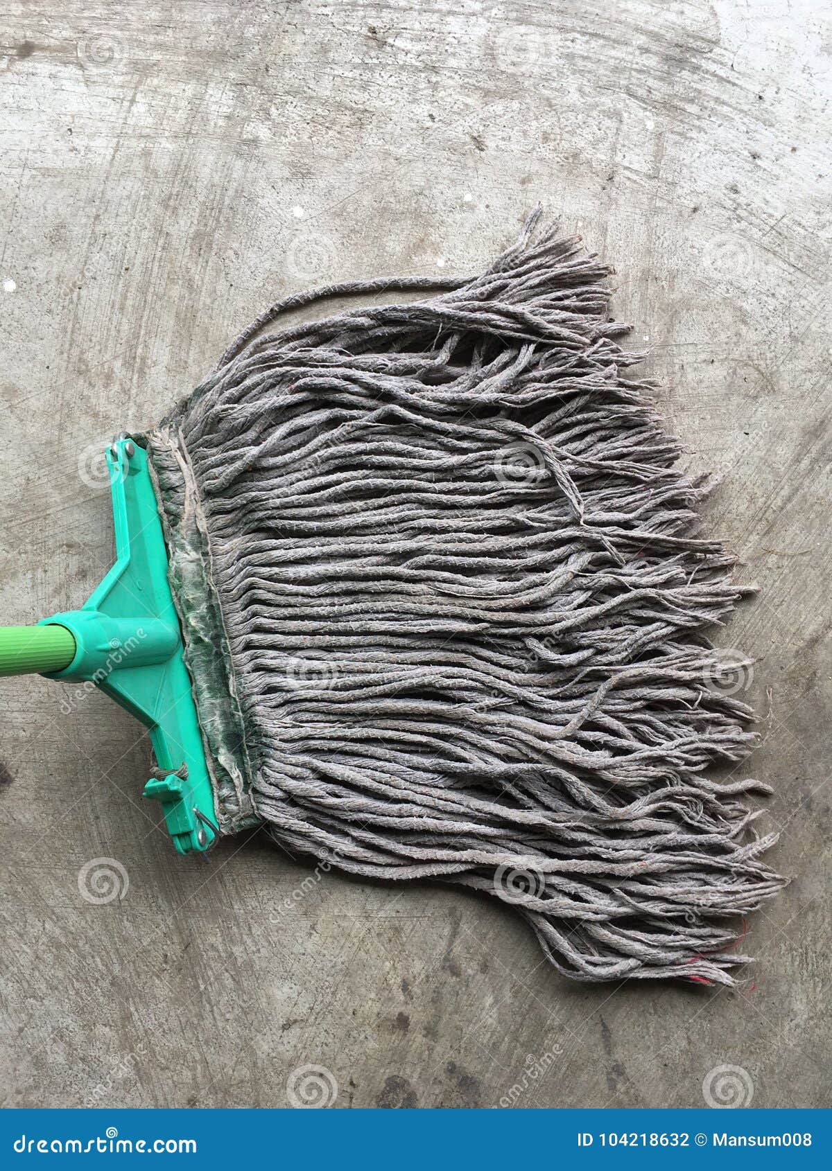 Old mop on cement floor stock photo. Image of plastic 104218632