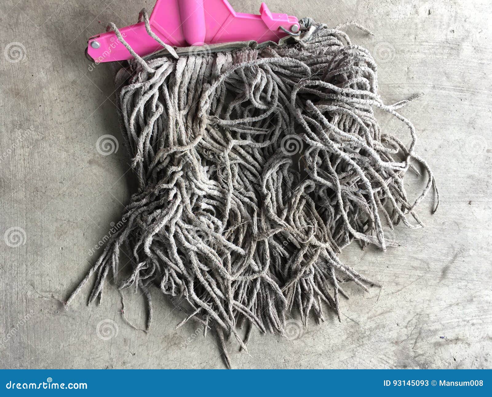 Old mop on cement floor stock image. Image of cement 93145093