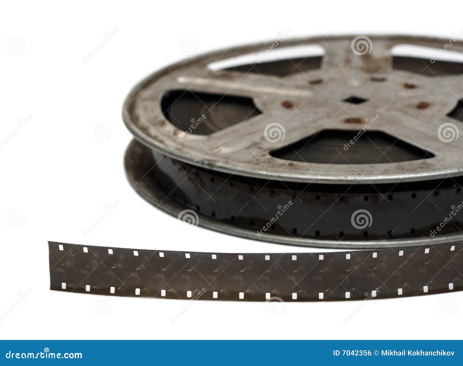 Roll of 8mm film reel on film with an old movie - Stock Photo