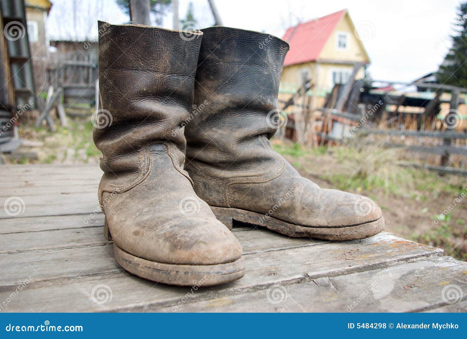 Old muddy farmers boots stock photo. Image of breeding - 5484298