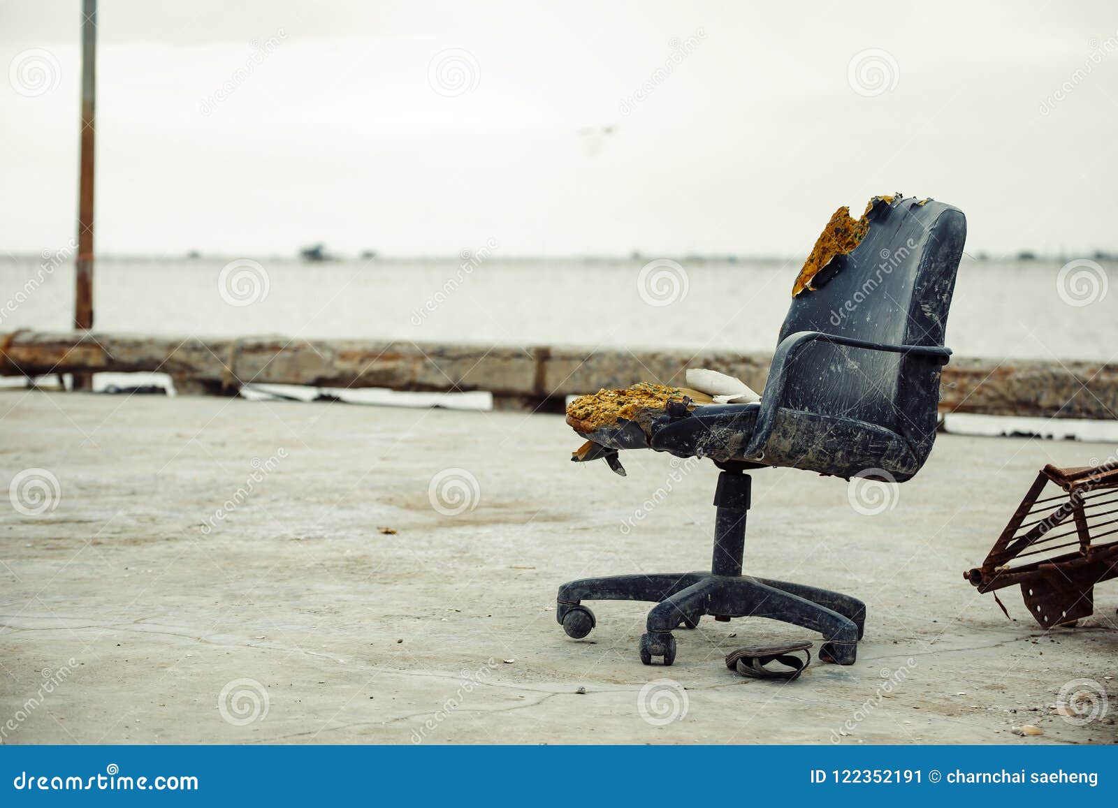 An Old Office Chair Outdoor Near The Sea And Sandals Is Under The Chair Stock Image Image Of Chair Perspective 122352191
