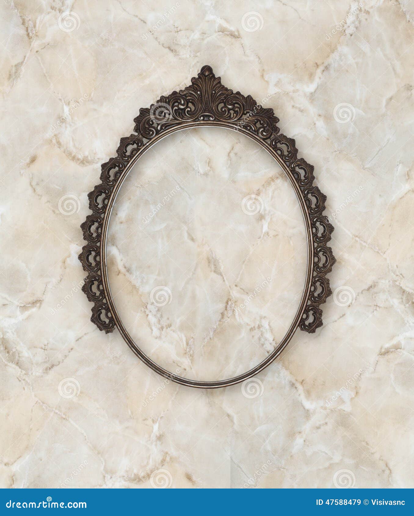 old oval picture frame metal worked on marble background