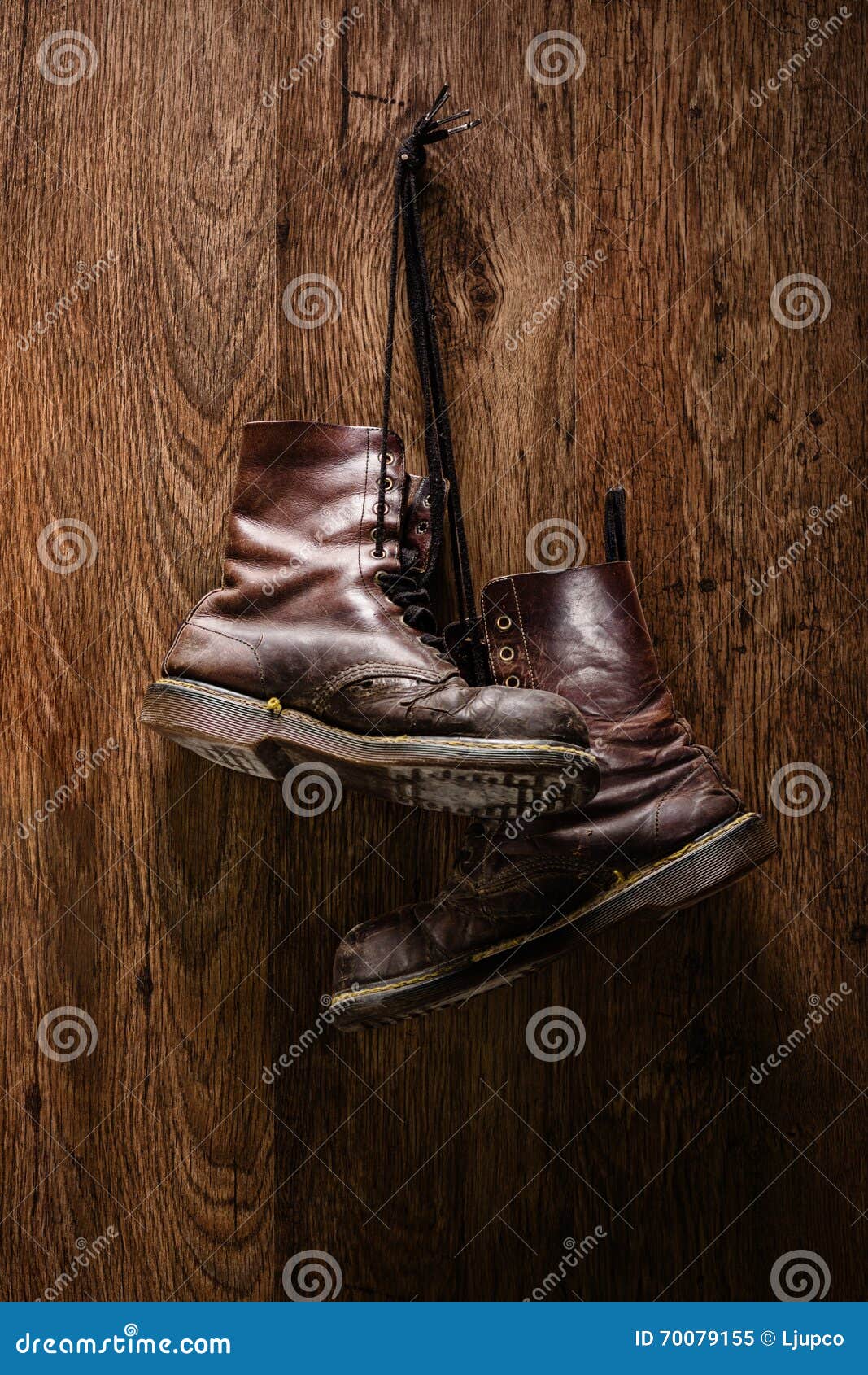 Old Pair of Brown Boots Hanging on a Wall Stock Image - Image of ...