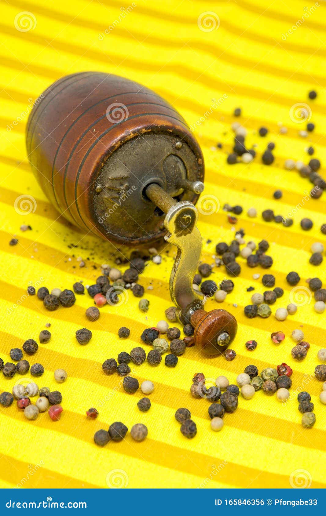 Download Old Pepper Grinder And Assorted Pepper Whole Grains And Ground Pepper On Yellow Cloth Stock Photo Image Of Handle Brown 165846356 Yellowimages Mockups