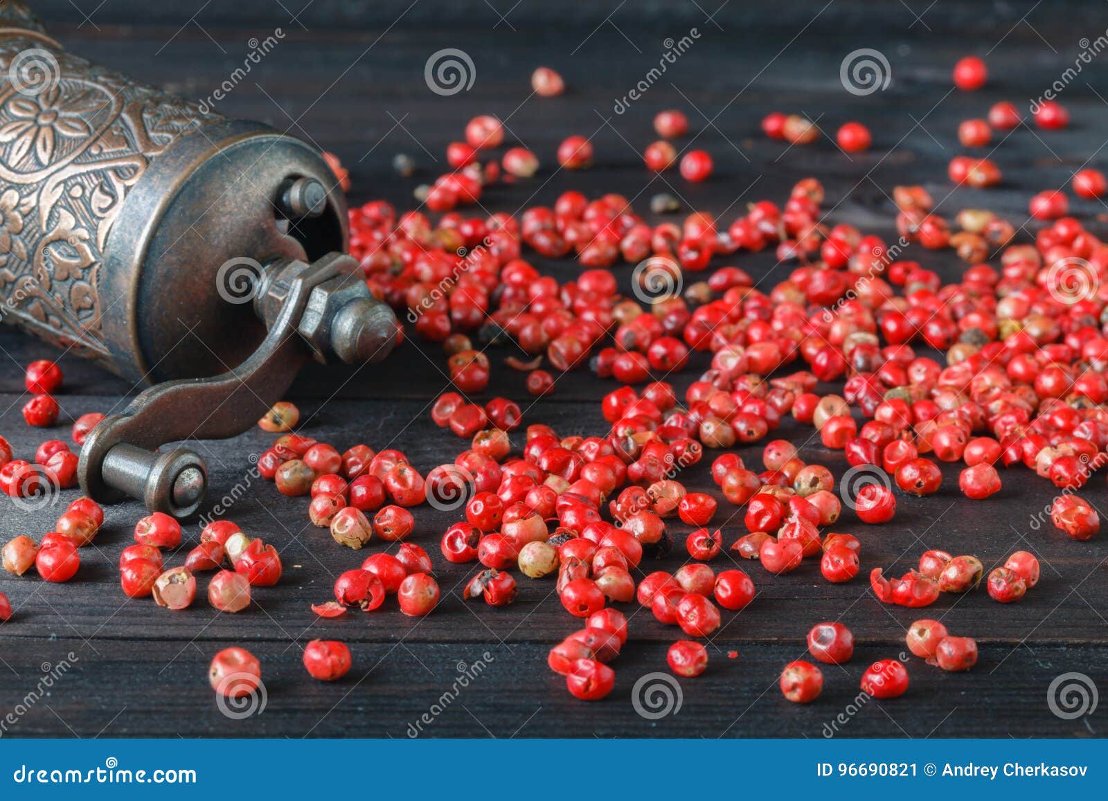 Old Pepper Grinder Mill with Different Dried Peppers Stock Image