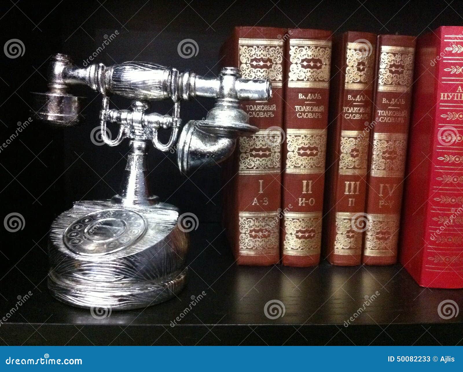 Old phone and books stock image. Image of bookshelf, books 50082233