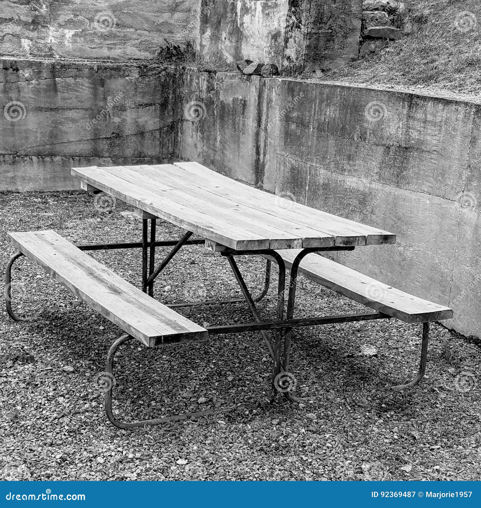 Old Picnic Table in Corner of Concrete Wall Stock Image - Image of ...