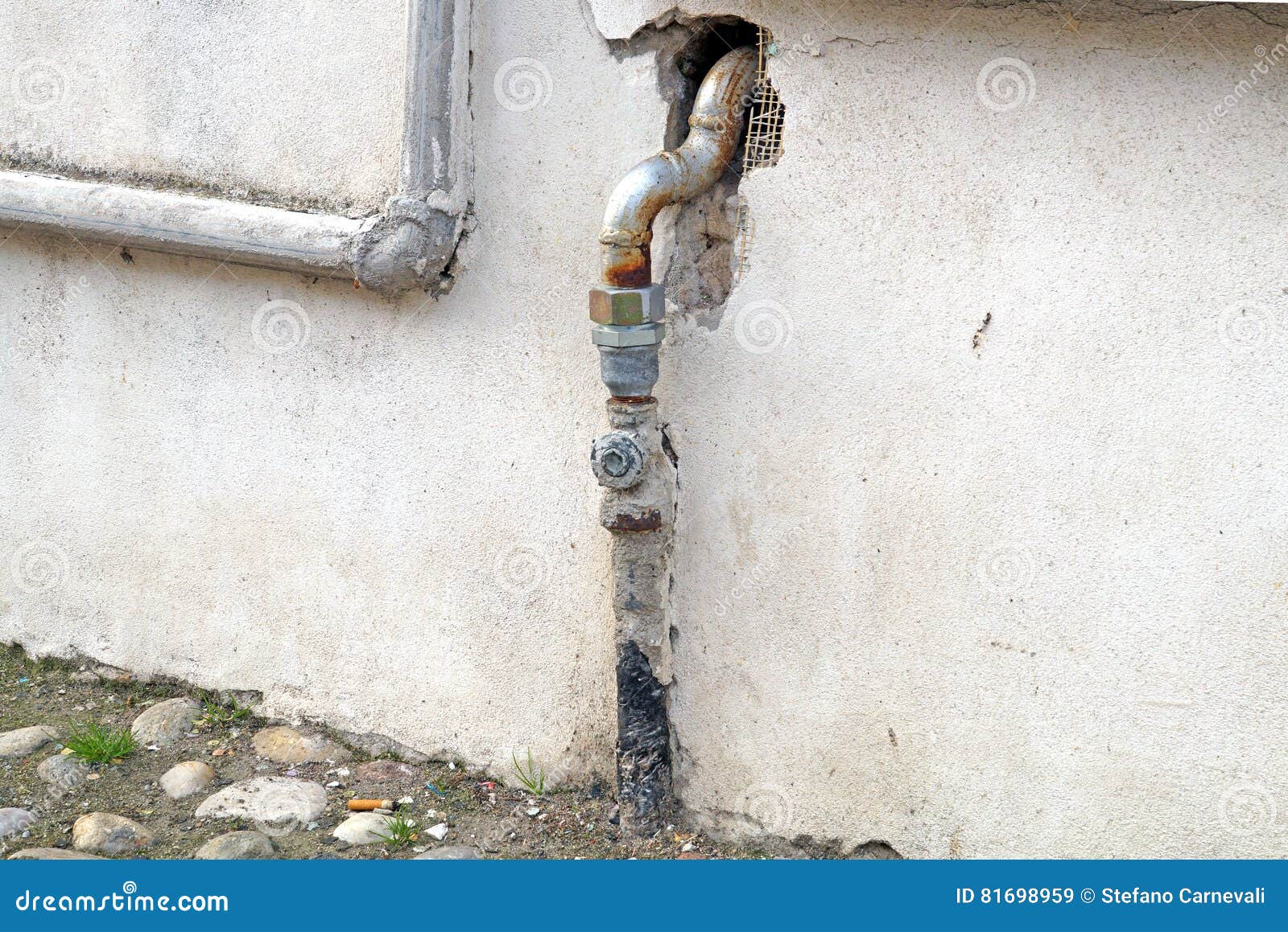 Old Pipe and Gate Valve from Pump at Concrete Wall Stock Image Image