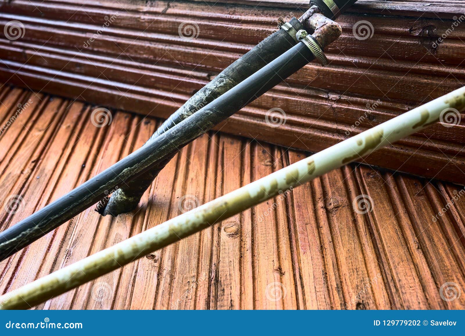 Old plastic pipes is close stock photo. Image of hose 129779202