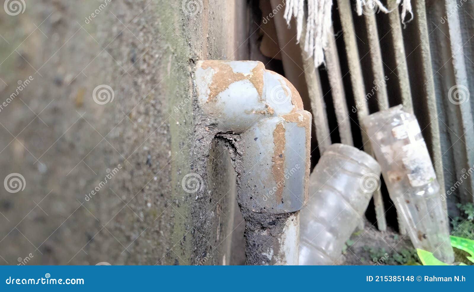 Old plumbing on the wall stock photo. Image of white 215385148