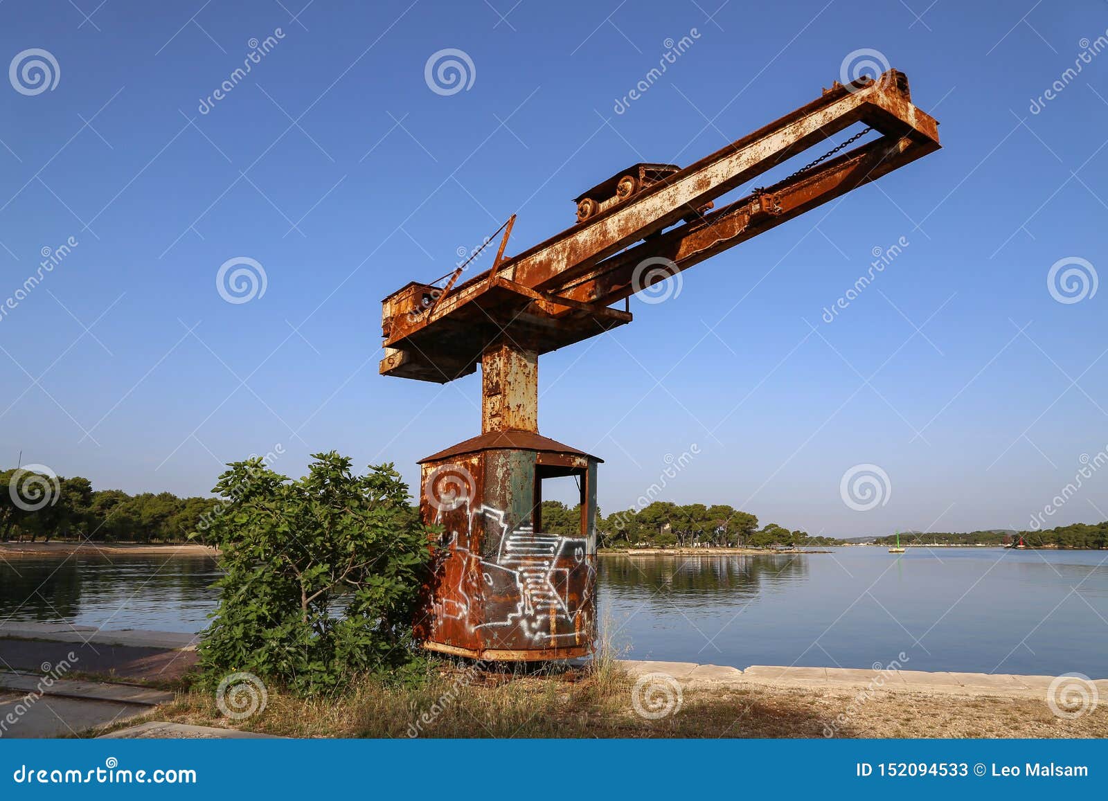 old port crane rusts in the sun