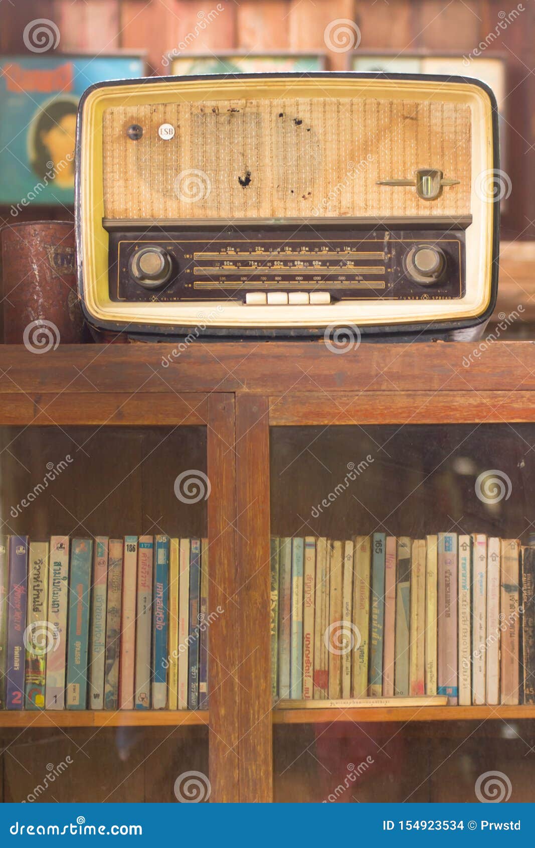 Old radio on bookcase editorial stock image. Image of sideboard 154923534