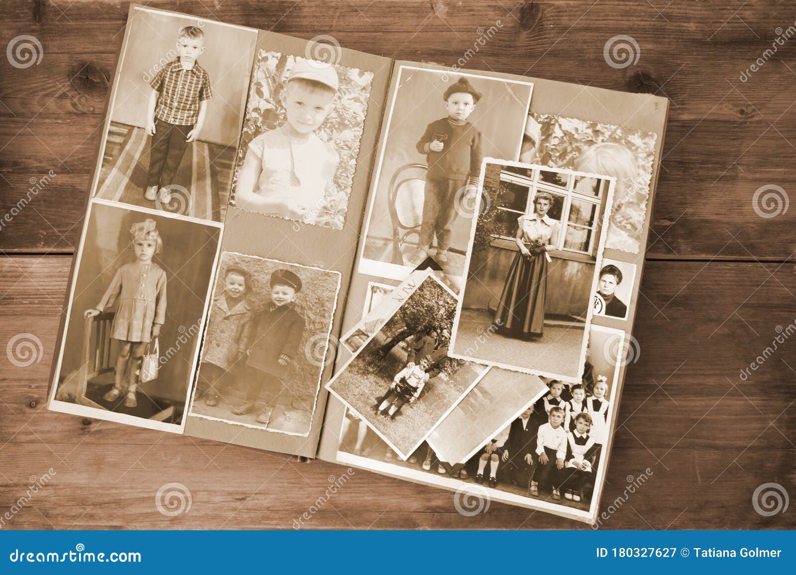 old retro album with vintage monochrome photographs in sepia color, the concept of genealogy, the memory of ancestors, family ties