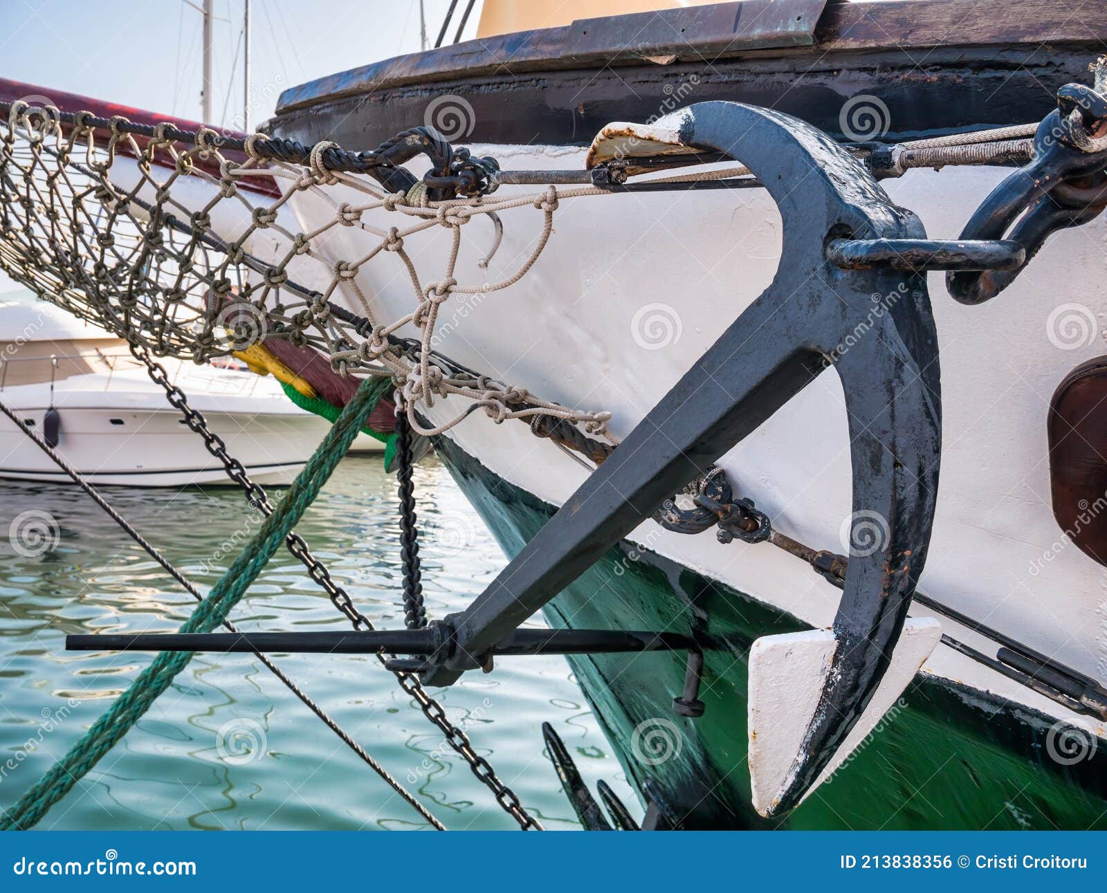 Old Retro Anchor Tied with Steel Chain and Ropes from an Old Ship in the  Harbour Stock Photo - Image of harbour, metal: 213838356